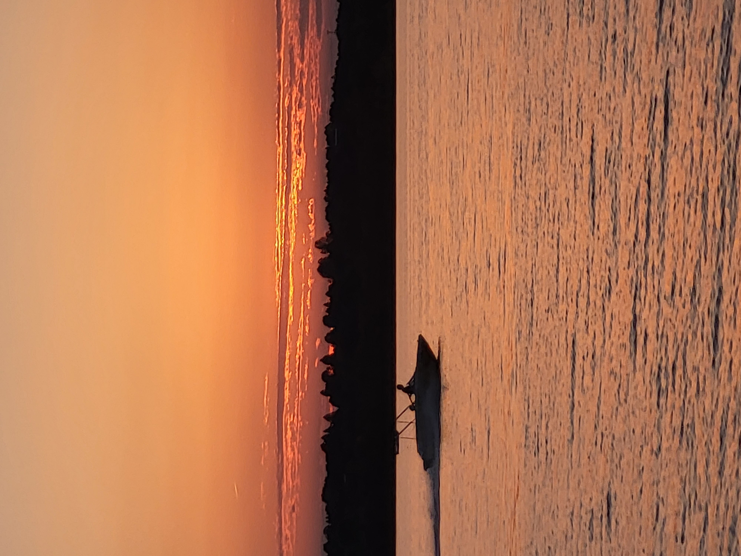 Photograph of a sunset over a lake.